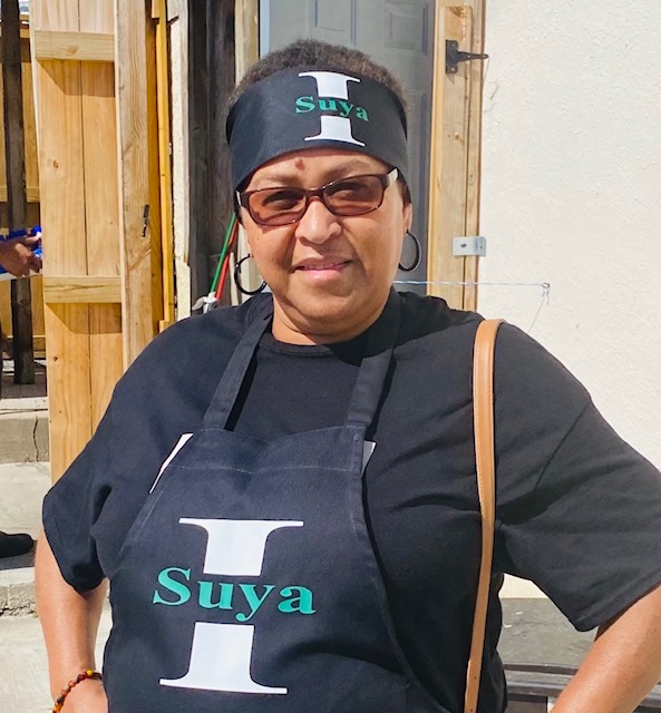lady in 'Suya' apron