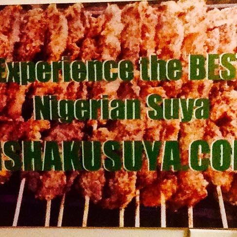 An advertisement for “the BEST Nigerian Suya” from SHAKUSUYA.CO, featuring skewered grilled meat